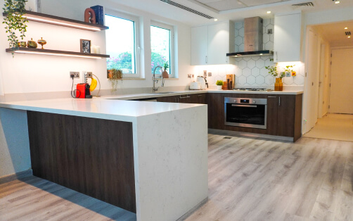 Walnut U-Shape Kitchen with Geometric Backsplash